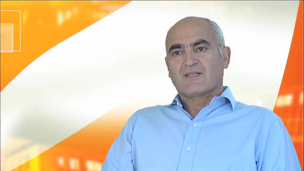 GSK Vaccines Business News, a presenter to camera against the branded orange and white studio background